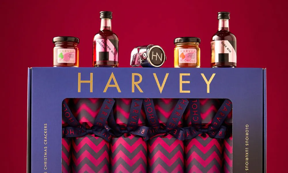 box of crackers with small jars and bottles on top