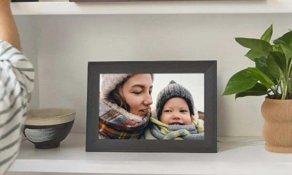 Digital photoframe with image of woman and baby