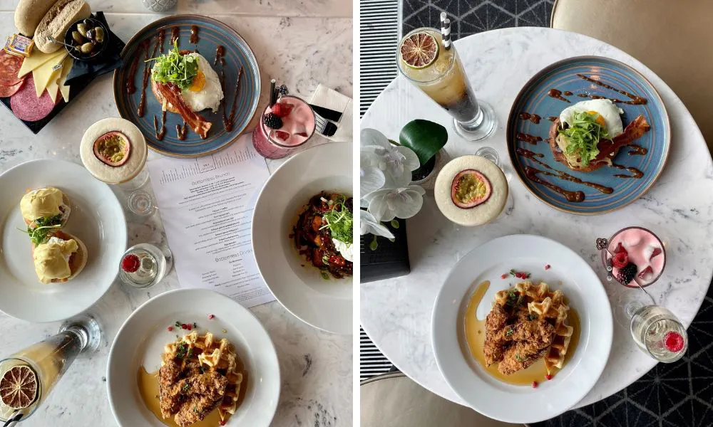 a variety of brunch dishes and cocktails on a table