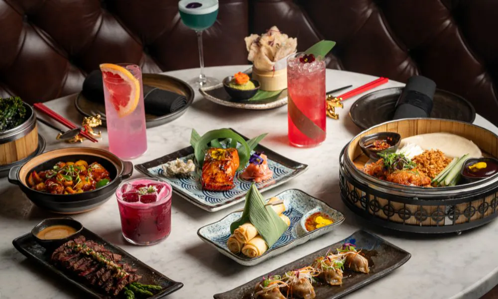 a selection of cocktails and Chinese dishes on a table
