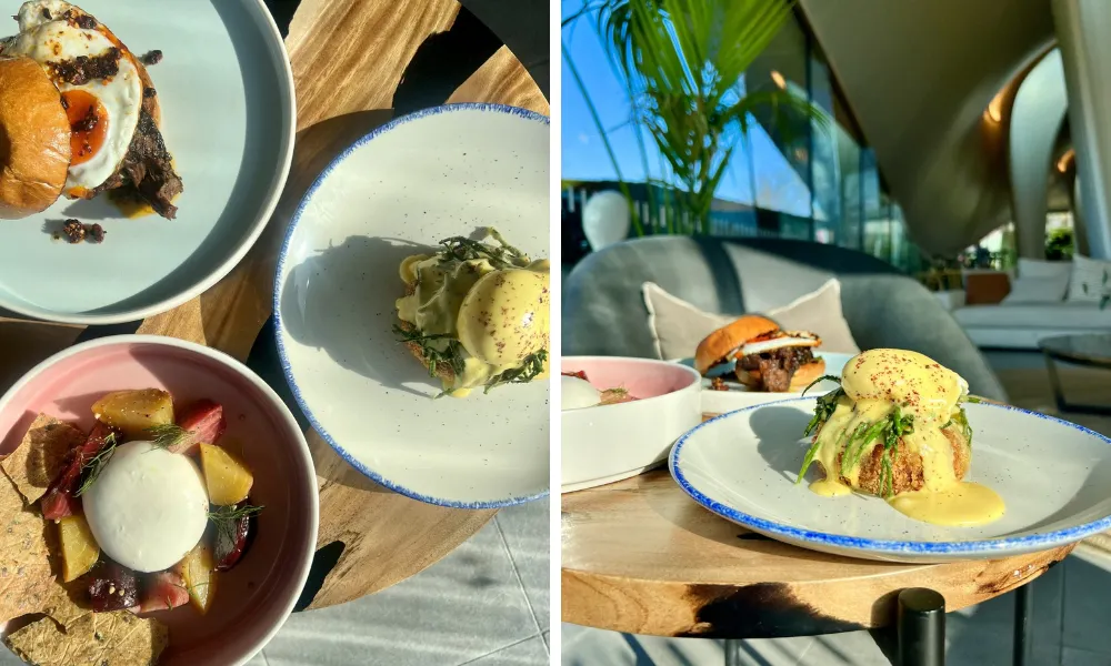 plate of eggs benedict with a crab cake and sauce