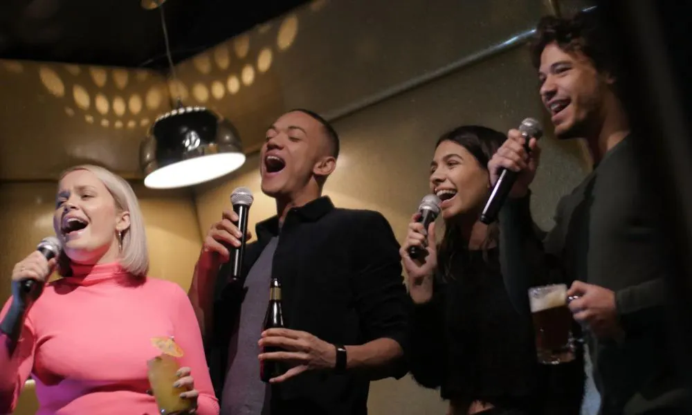 a group of people singing karaoke