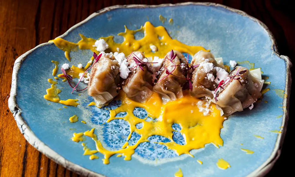Dumplings and sauce on a plate