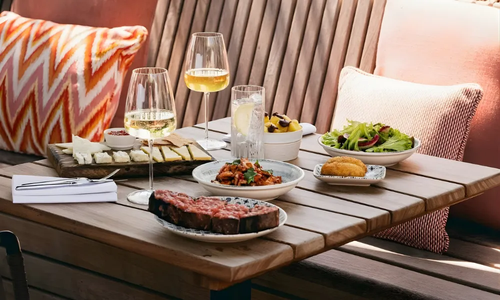 food and cocktails on a table in the dun