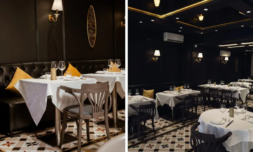 dark and moody dining room with yellow cushions and patterned floorboard