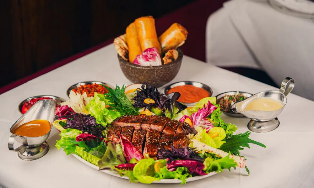 roasted duck on a bed of lettuce