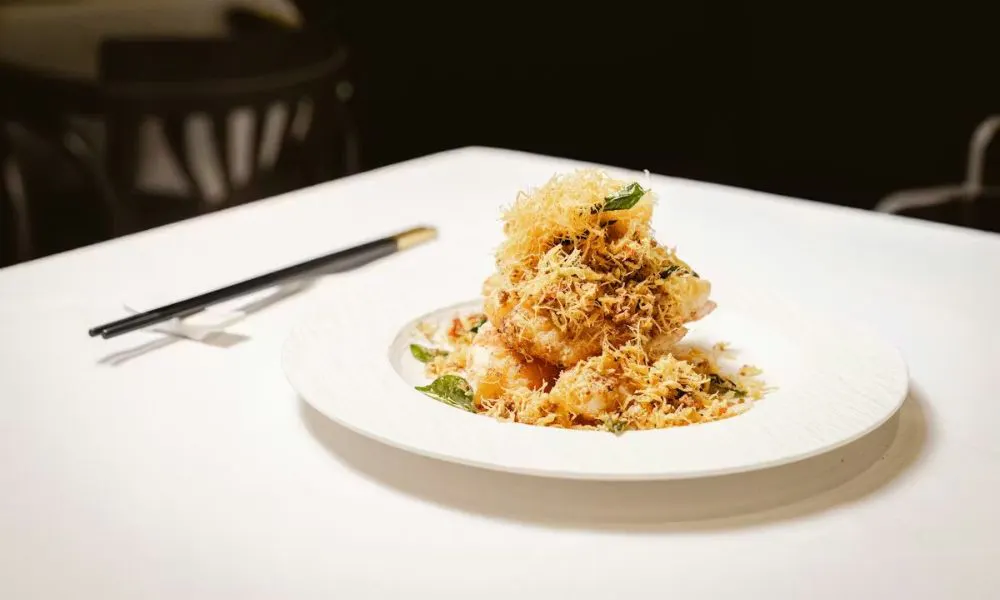 chinese dish topped with crispy onions