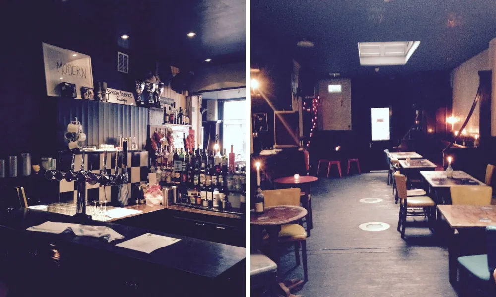 dark pub bar and candle lit tables