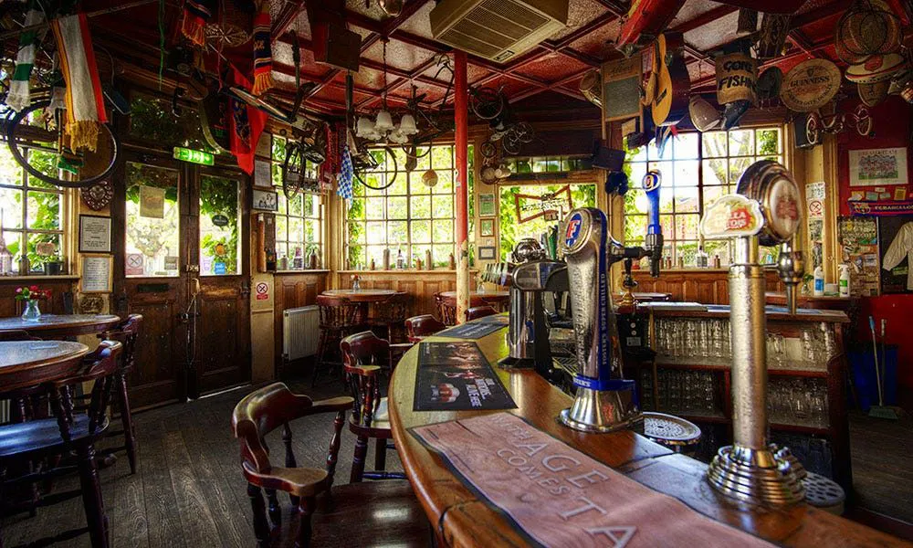 pretty Irish pub interiors with ivry around the windows