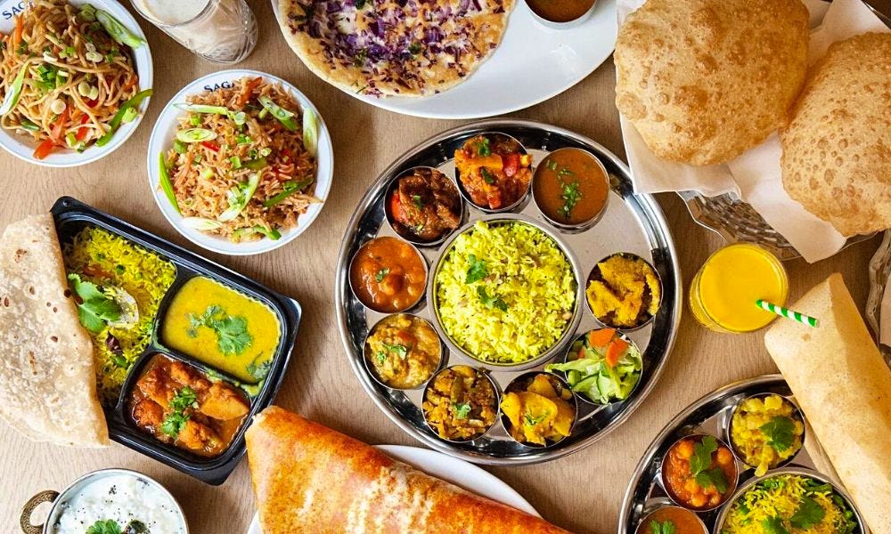 A table covered in Indian food