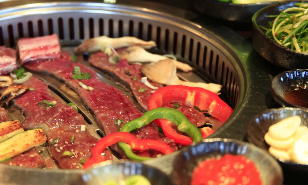 A plate of meat and salad