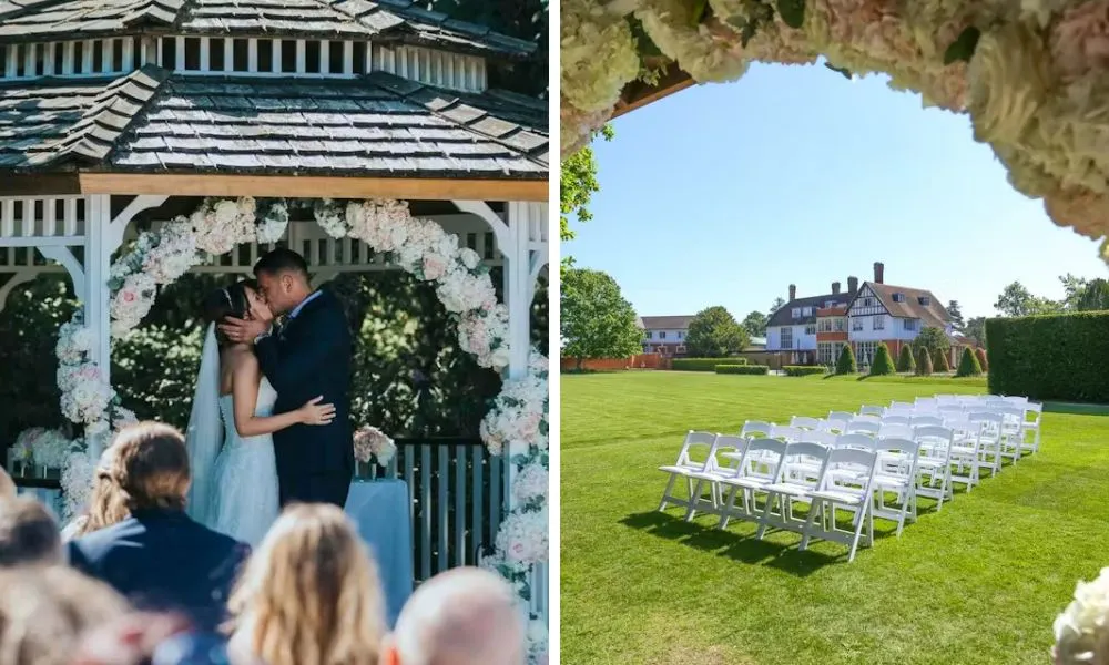 couple kissing under a flower arch and chairs forming an aisle