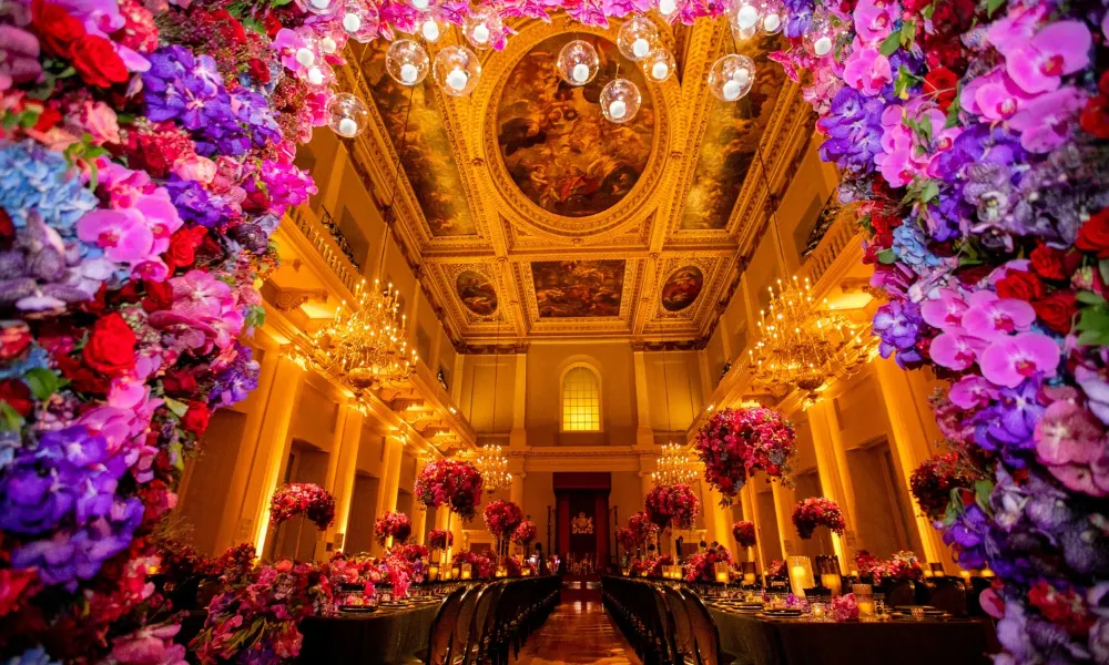 ornate banqueting hall with floral arrangement