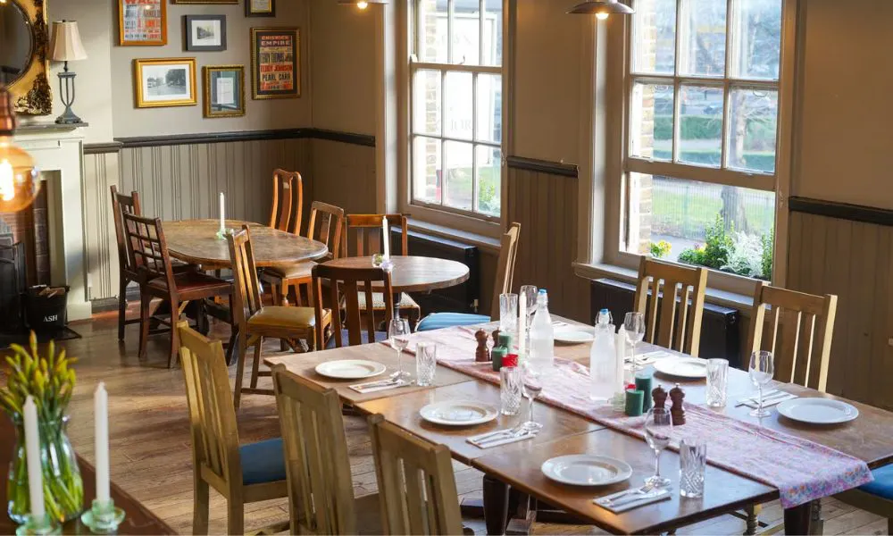 a pub-style interior set up for a wedding breakfast