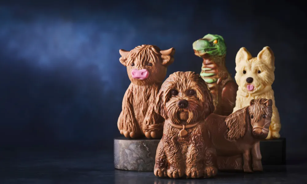 dogs dinosaur and cow in chocolate form
