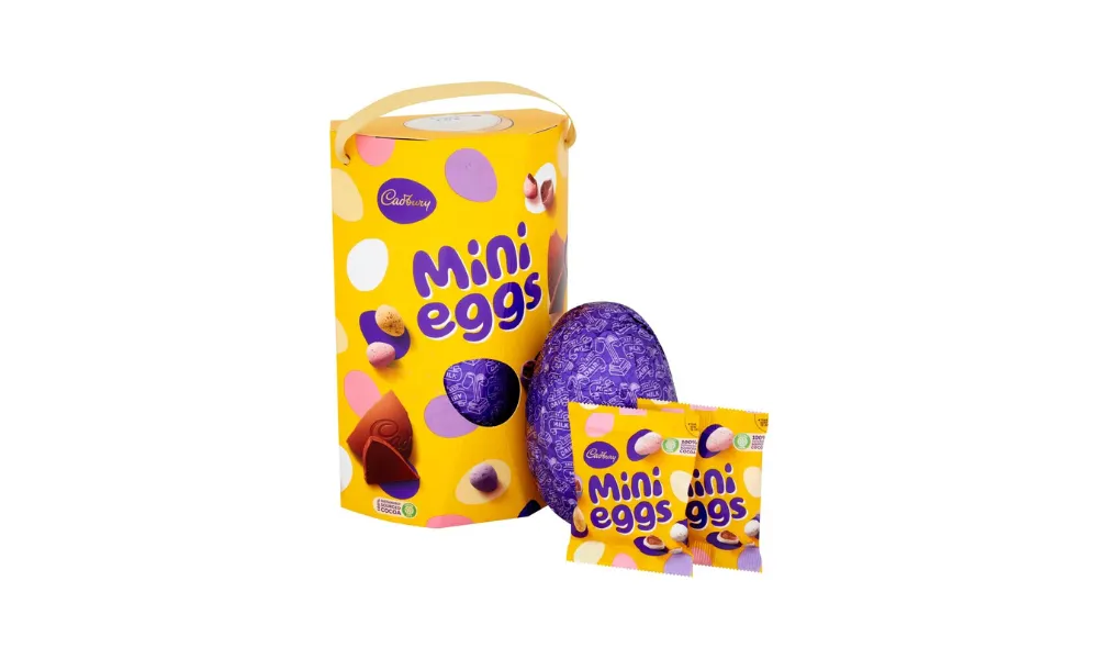 yellow cyclindrical box with two packets of mini eggs