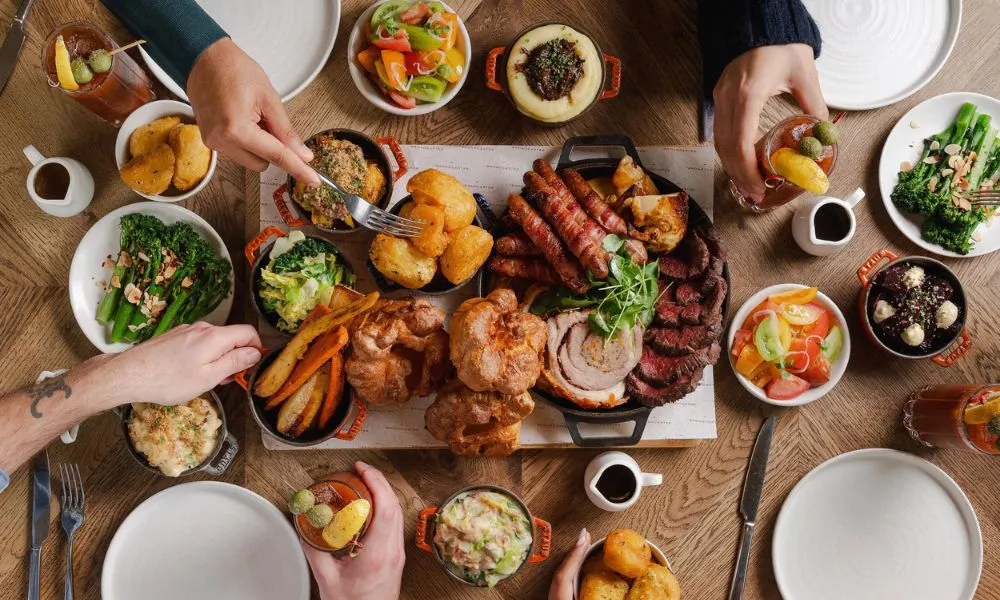 sharing roast with beef pork sausages and trimmings