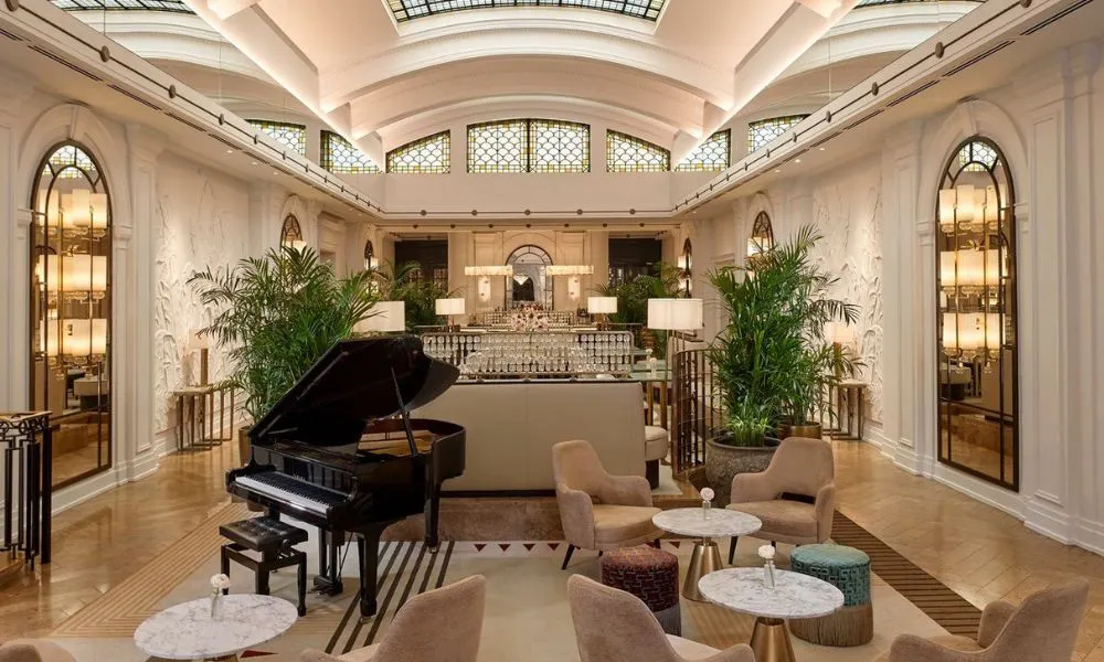 luxury hotel with grand piano and high ceiling