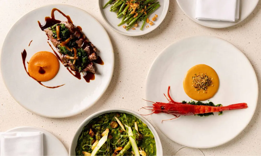 plates of vibrant seafood and orange sauces