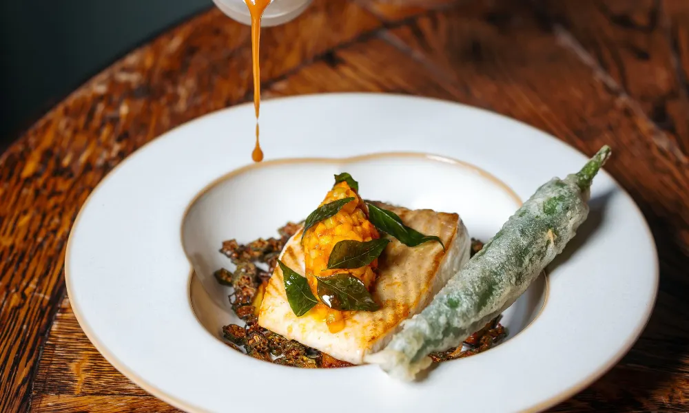 fish topped with sambal and tempura stuffed chilli