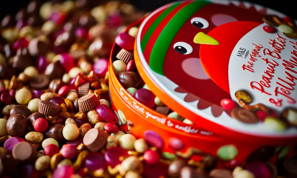 Sharing snack mix with peanut butter cupts