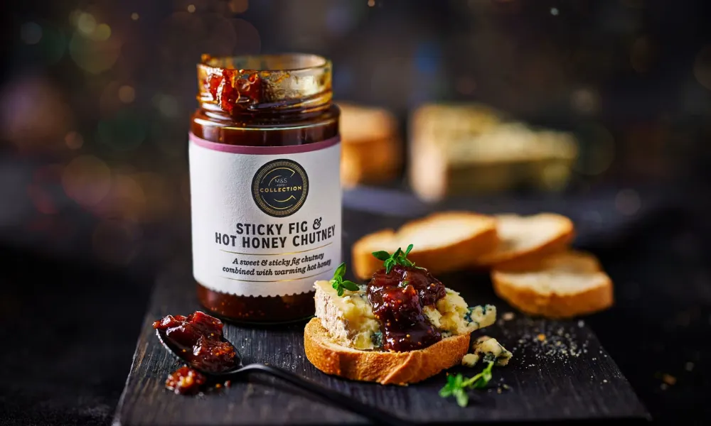 Jar of chutney with cheese and bread