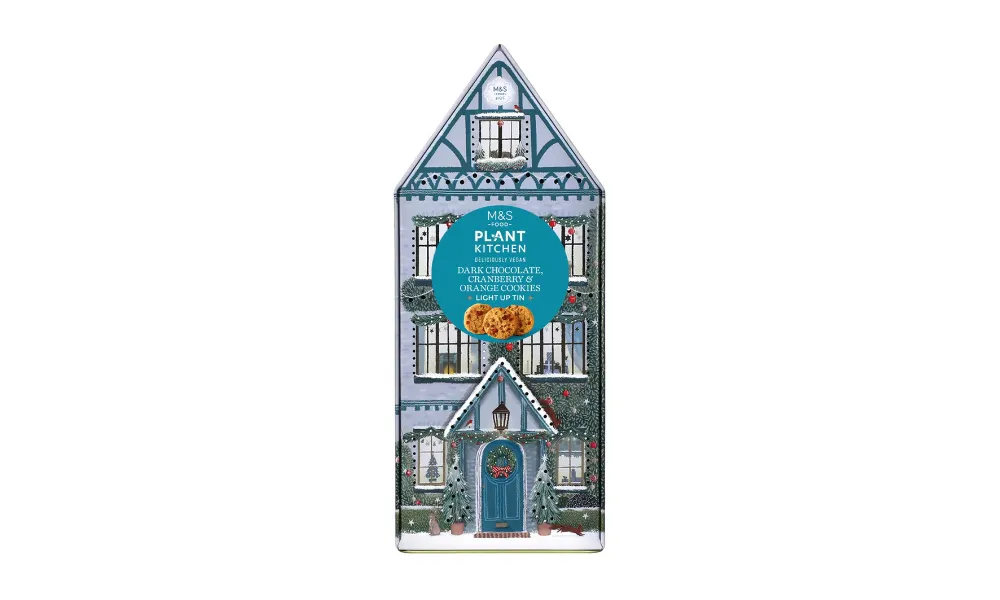 vegan light-up biscuit tin designed as a christmas house