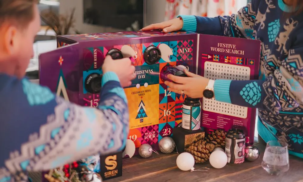 people opening the siren beer advent calendar 2025