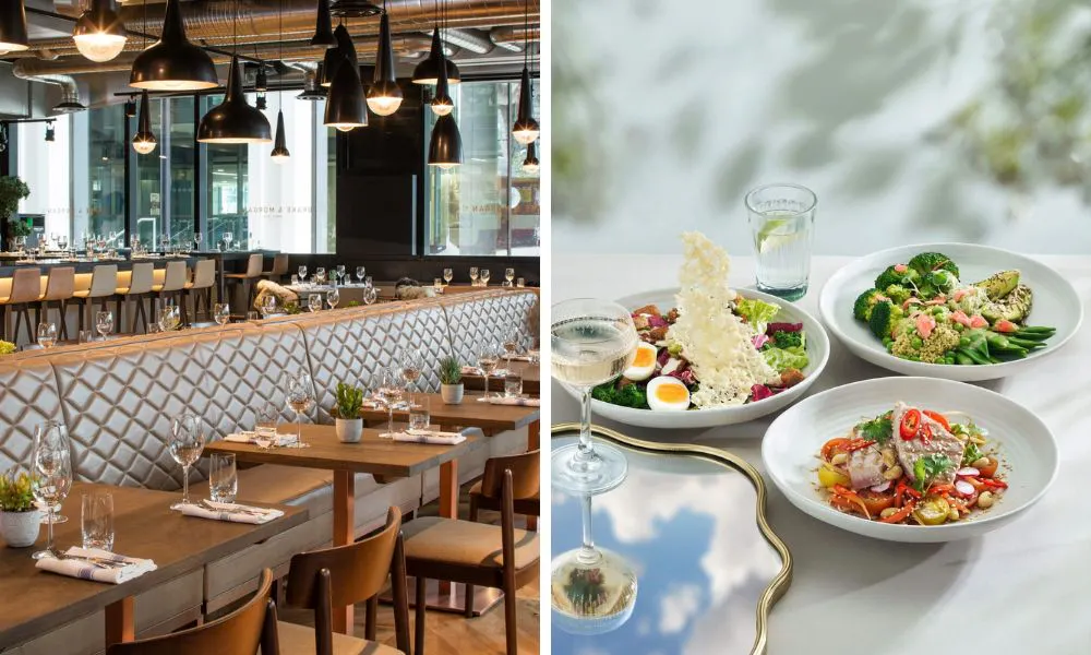 restaurant with rows of wooden tables and selection of salads with champagne