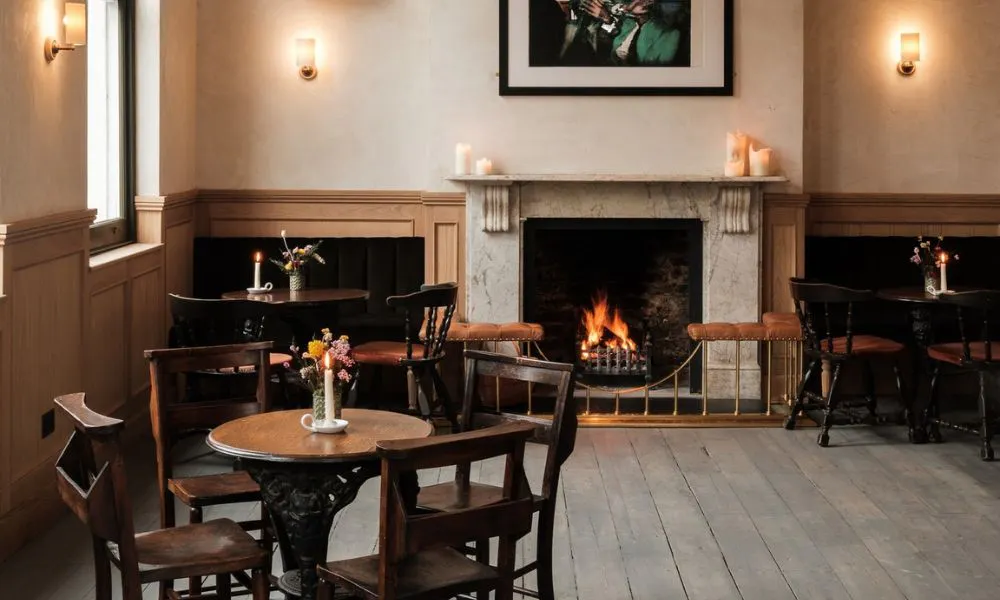 the cosy, fireplace and dining room at The Pelican