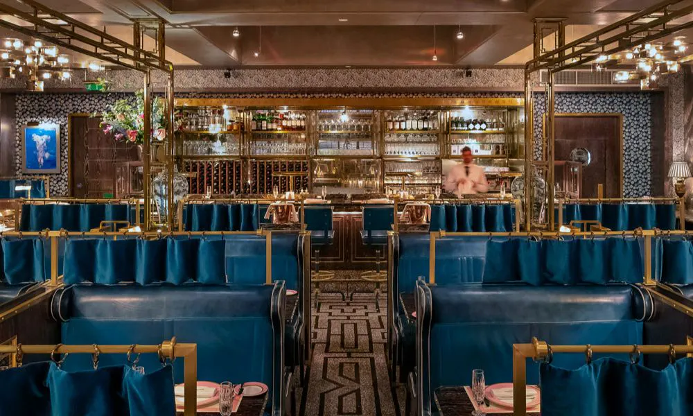 Royal blue and gold booths at Bob Bob Ricard