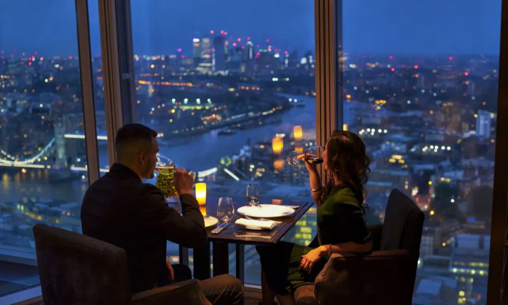A couple dining with great views of London
