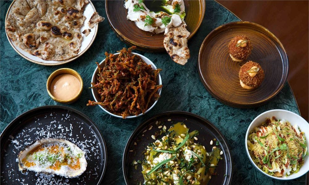 Plates of food with roti and fried food