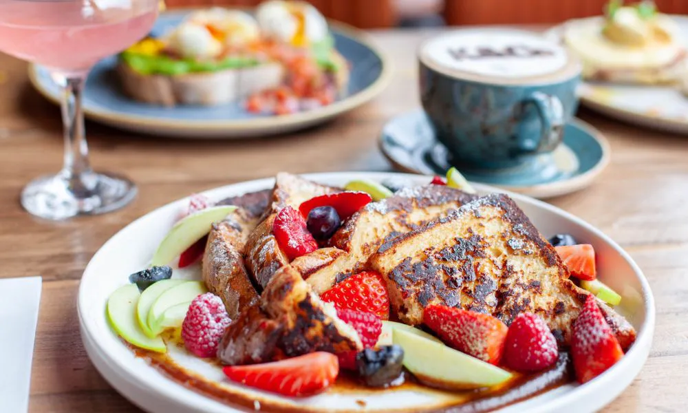 a palte of french toast with fruit