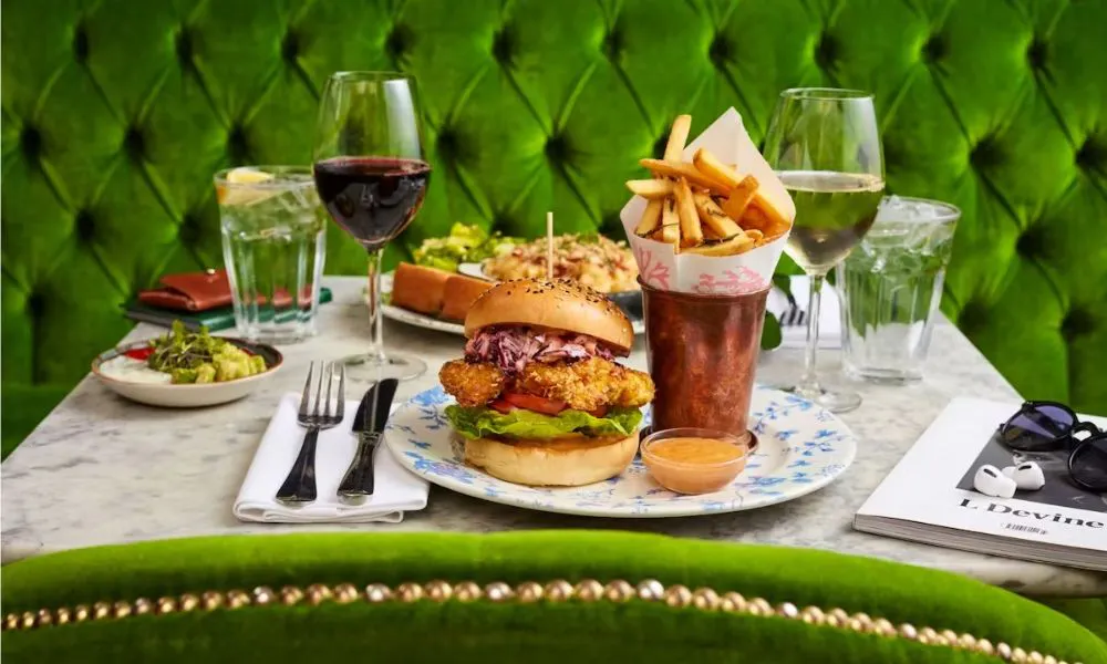 green velvet furniture and burger with fries