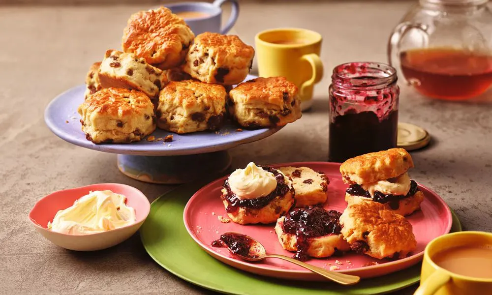 a selection of scones with jam and cream
