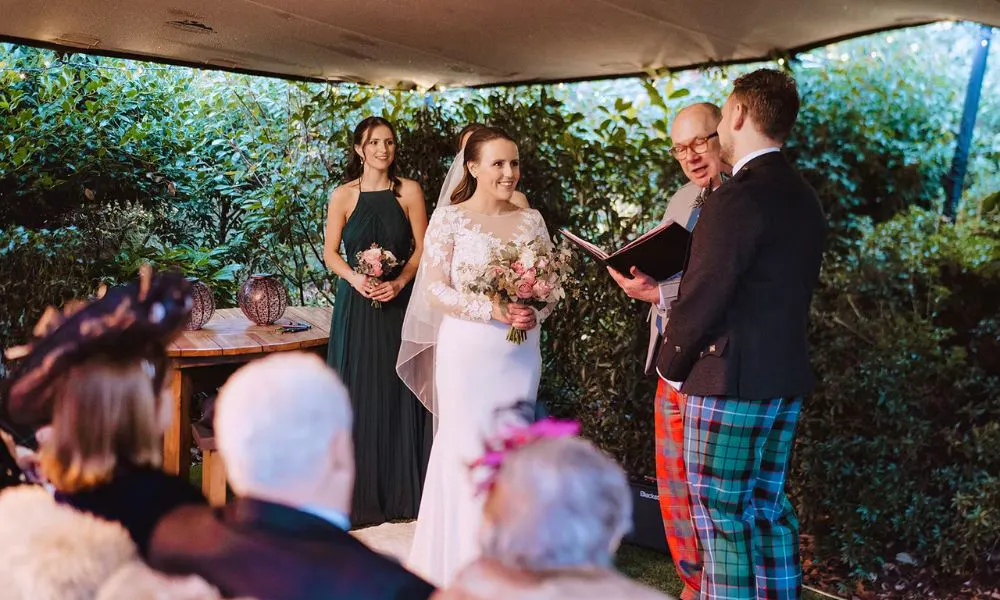 Couple at ceremony in the courtyard