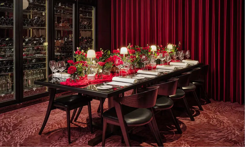 Dark table set with wine glasses