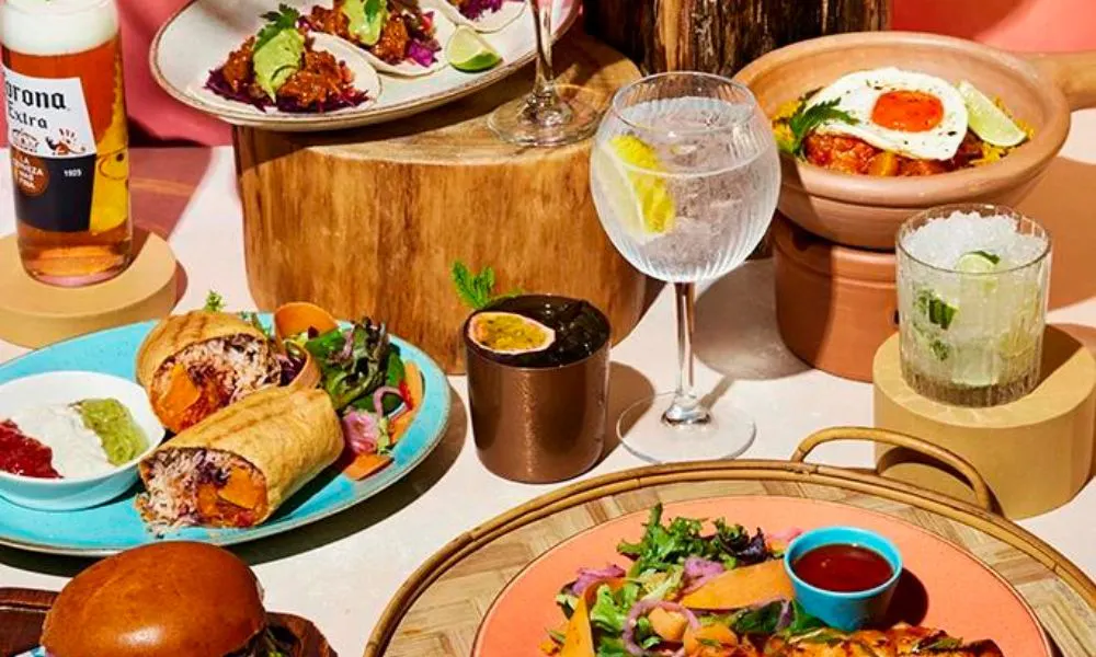 A selection of tacos, burritos, cocktails, beer and gin and tonic 