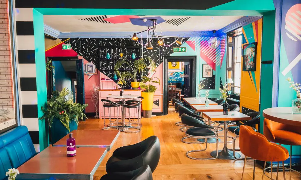 The inside of the Magic Garden with multi coloured walls and scallopped shaped sheets 