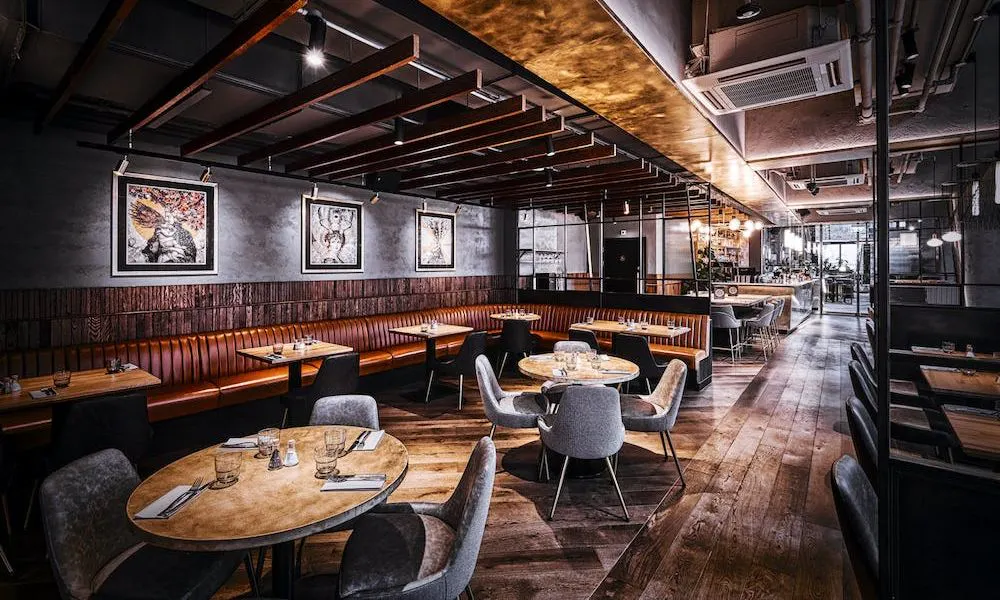 An industrial chic dining room with brown leather