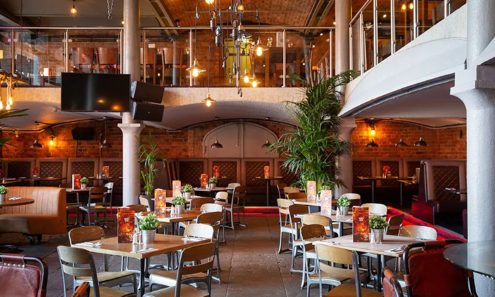 Dining room with mezzanine floor and plants