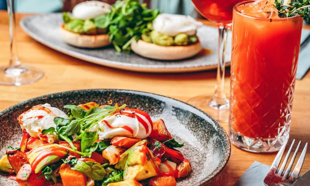 brunch plates featuring poached eggs and salad