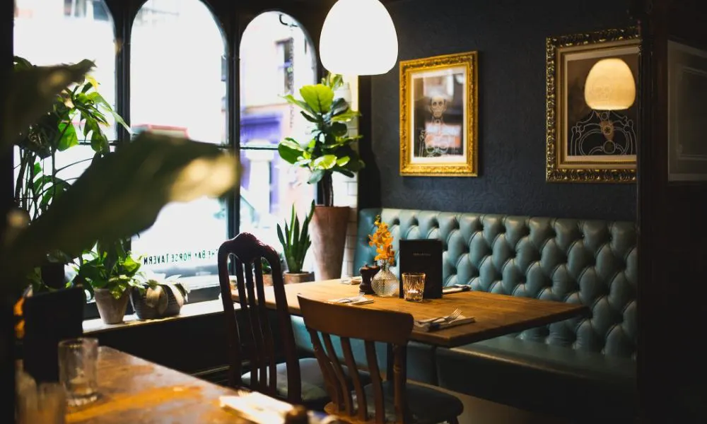 a restaurant table next to a large window