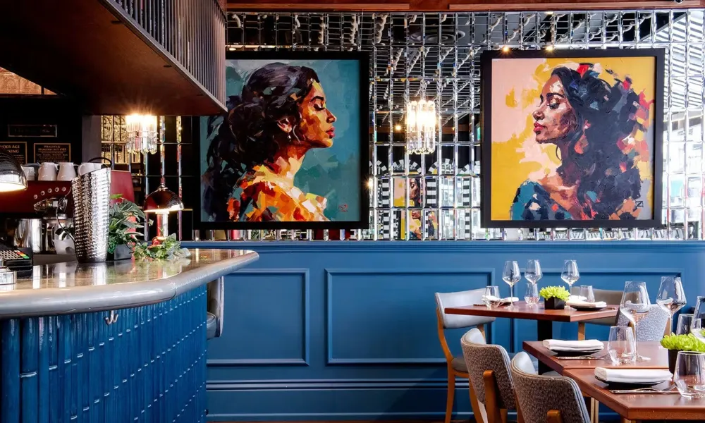dining room and bar with colourful oil paintings