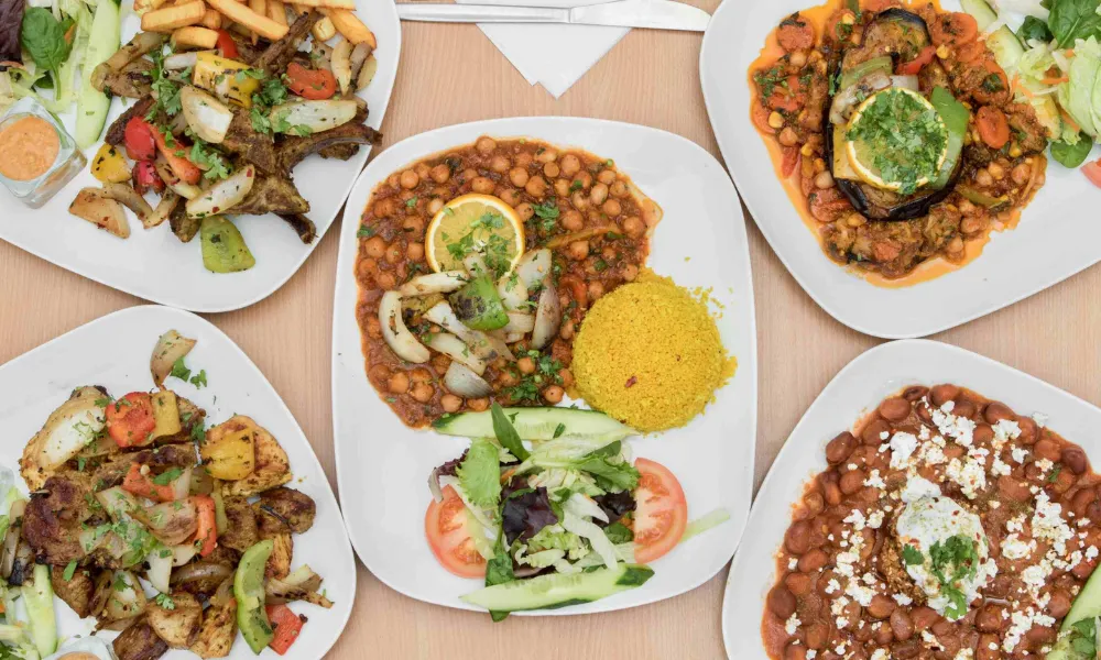 selection of plates with rice and beans and salad